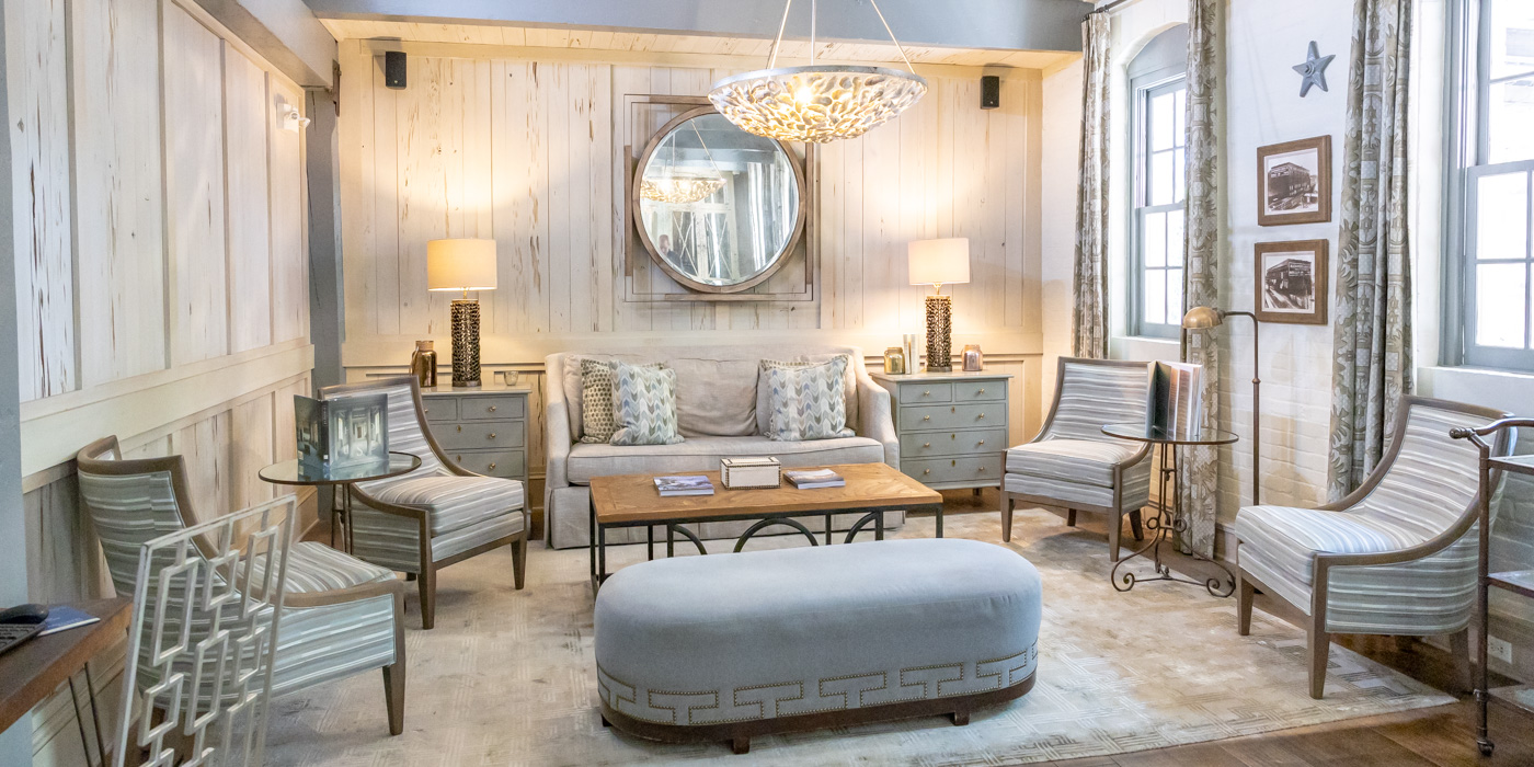 a living room with a couch and chairs